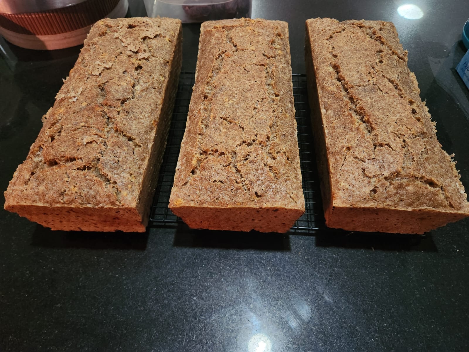 Rye loaves cooling on a rack